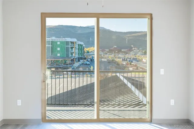 a view of a room with a glass door