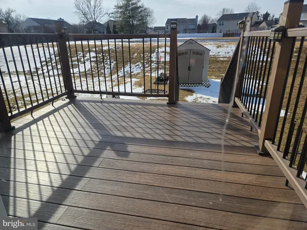 a view of balcony with wooden floor