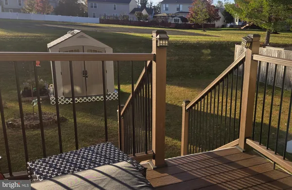 a view of a balcony with wooden floor