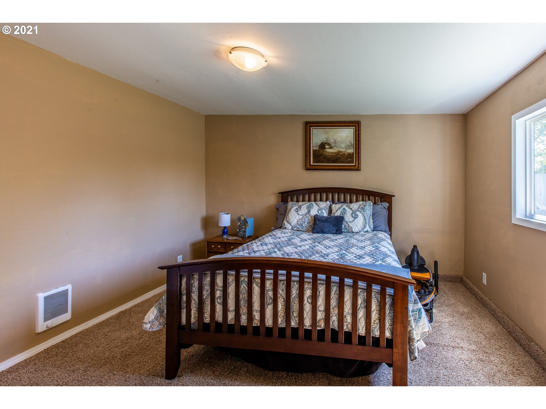 2405 E Street Springfield, OR 97477 - Photo 23 of 27 a bedroom with a bed and a window