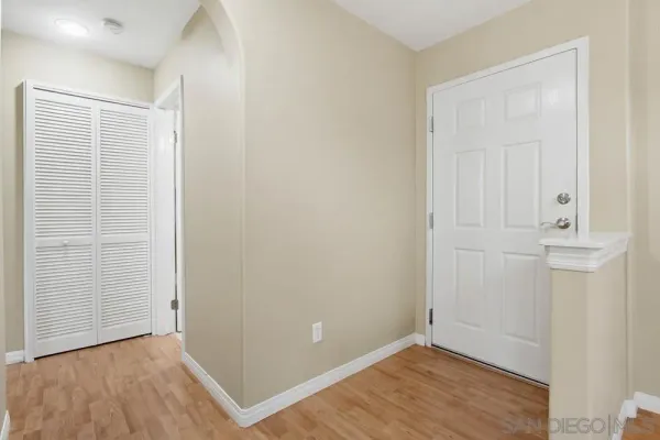 an empty room with wooden floor