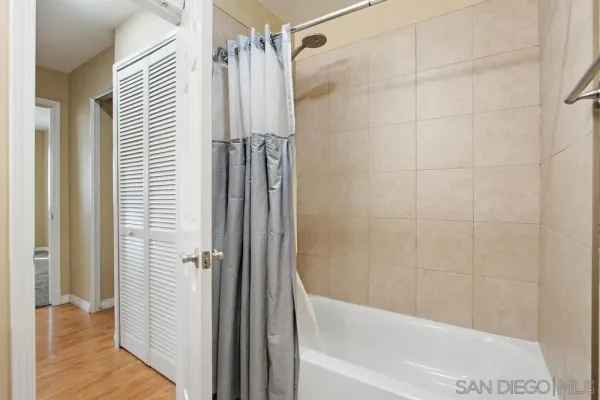 a bathroom with a shower and a tub