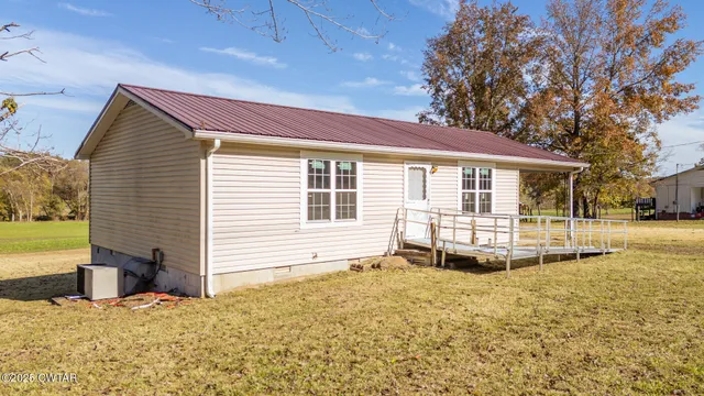 a view of a house with a snow in the yard