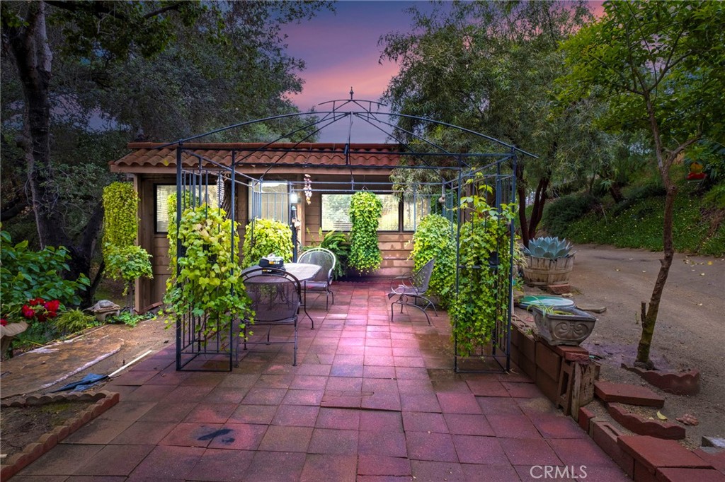 a view of a backyard with sitting area