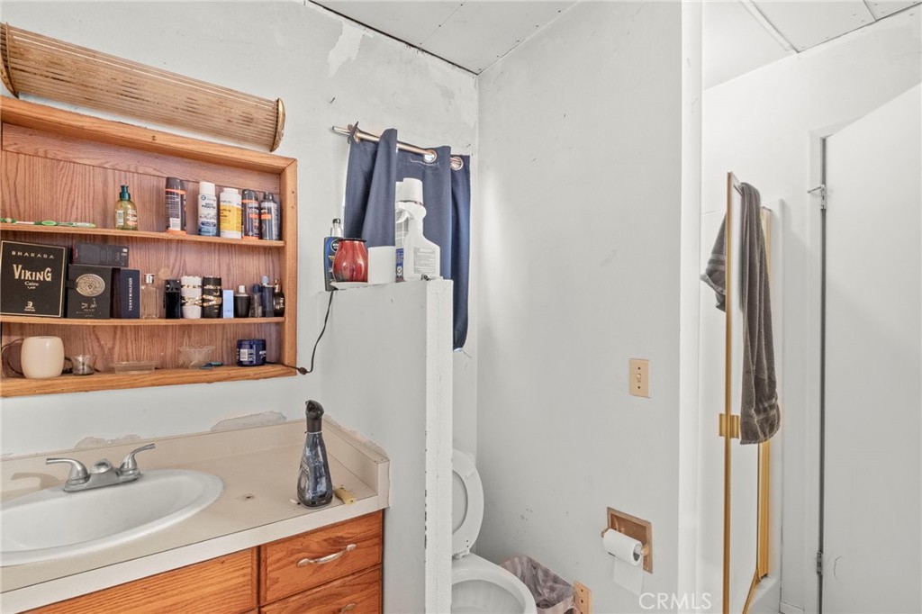 42185 Oak Canyon Road Hemet, CA 92544 - Photo 16 of 42 a bathroom with a sink toilet and shower