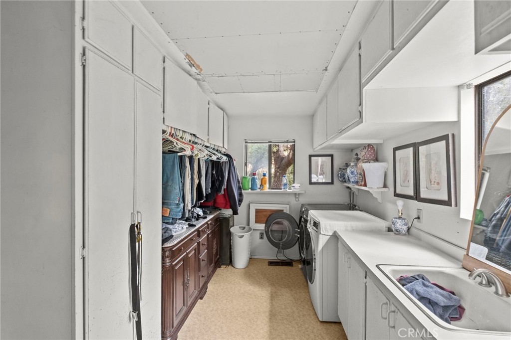 42185 Oak Canyon Road Hemet, CA 92544 - Photo 17 of 42 a storage room with washer and dryer