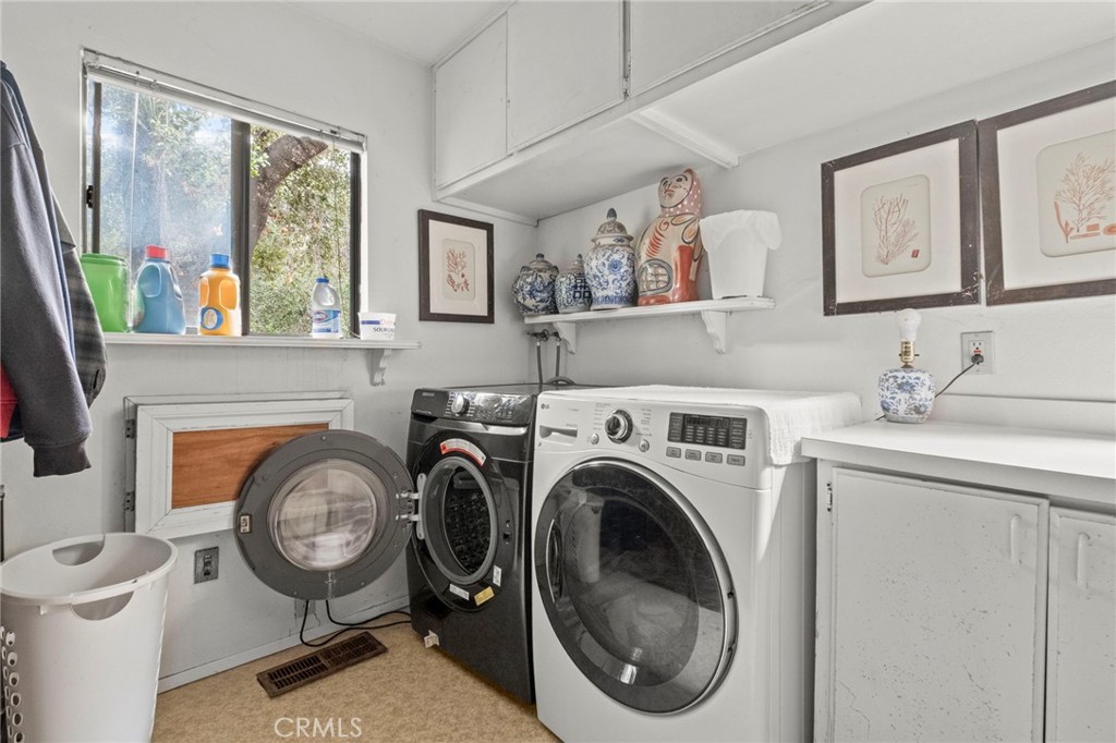 42185 Oak Canyon Road Hemet, CA 92544 - Photo 18 of 42 a view of a bedroom with washer and dryer