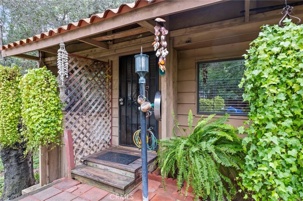 42185 Oak Canyon Road Hemet, CA 92544 - Photo 3 of 42 a front view of a house with a porch