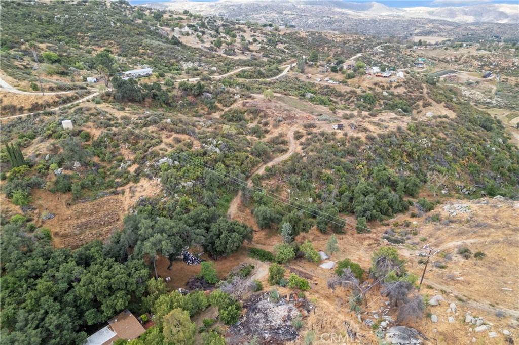 42185 Oak Canyon Road Hemet, CA 92544 - Photo 34 of 42 a view of a city with lush green forest
