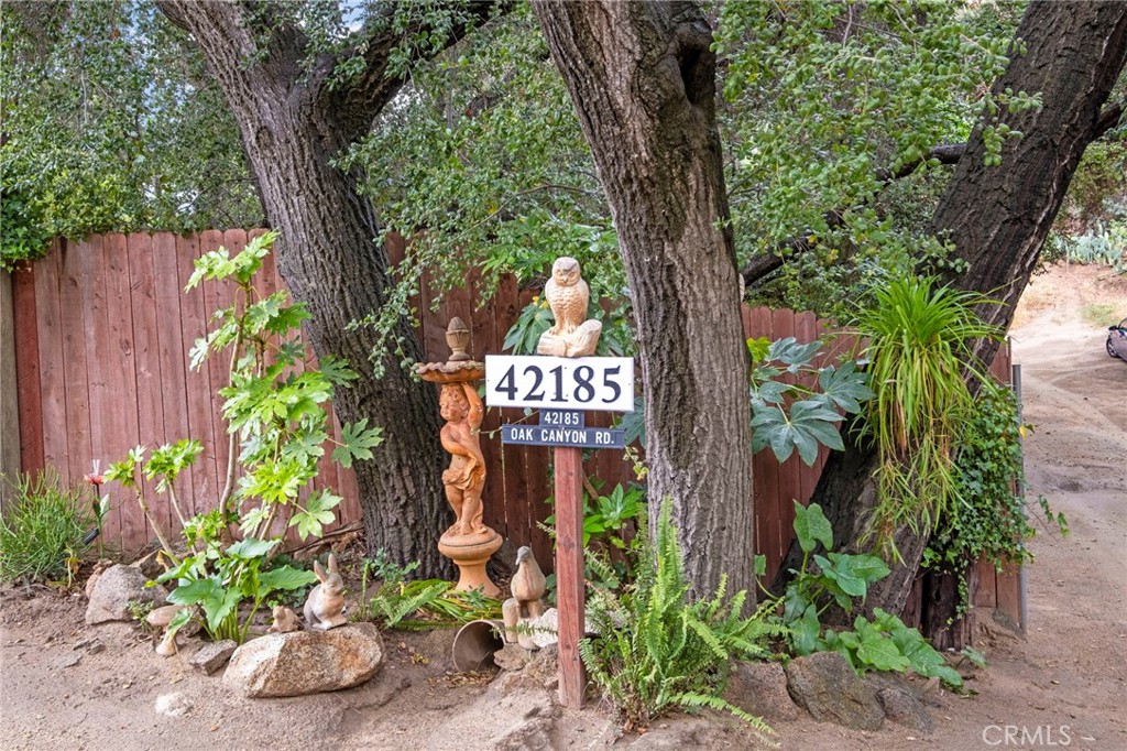 42185 Oak Canyon Road Hemet, CA 92544 - Photo 41 of 42 a sign that is sitting in the forest