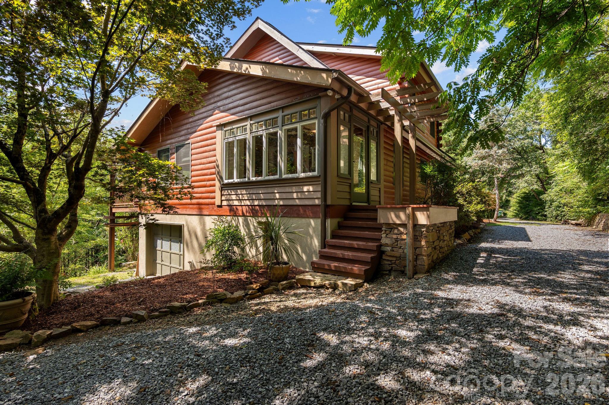 150 Avondale Ridge Road Asheville, NC 28803 - Photo 1 of 45 a front view of a house with a yard