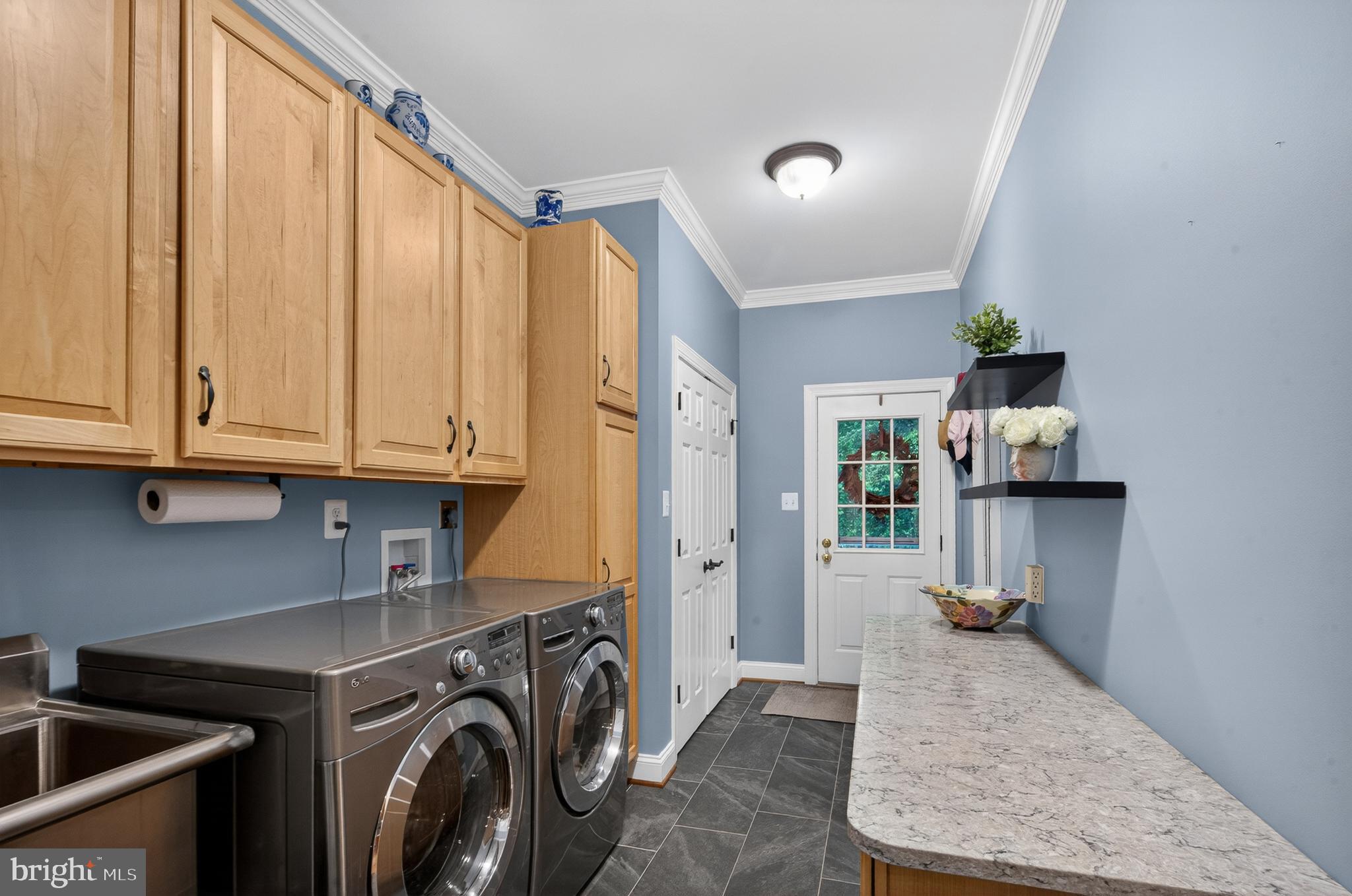 6601 Colchester Road Fairfax Station, VA 22039 - Photo 30 of 78 a view of a kitchen with utility area and cabinets