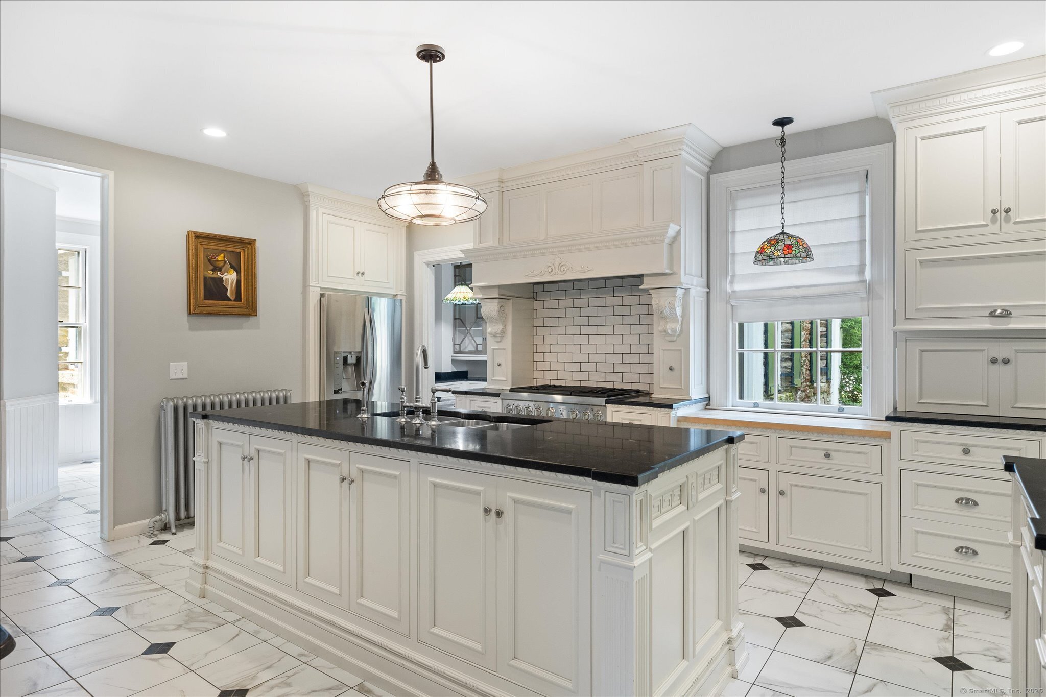 357 Wrights Crossing Road Pomfret, CT 06259 - Photo 11 of 40 a kitchen with white cabinets and window