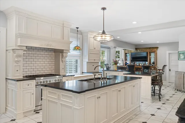 a kitchen with sink cabinets and window