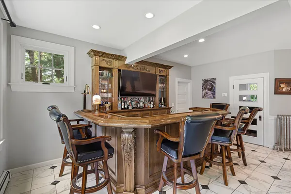 a view of a dining room with furniture and a window