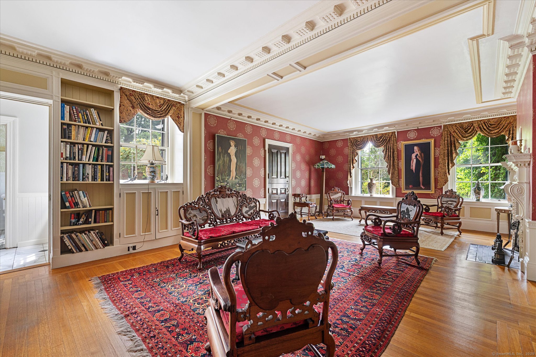 357 Wrights Crossing Road Pomfret, CT 06259 - Photo 23 of 40 a living room with furniture and a book shelf