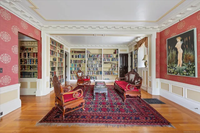 a living room with furniture rug and wooden floor