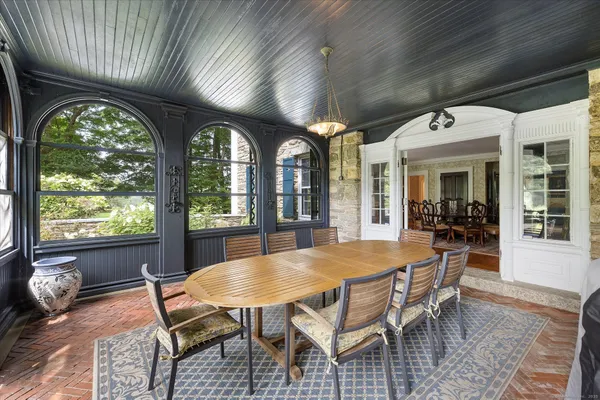 a view of a dining room with furniture window and outside view