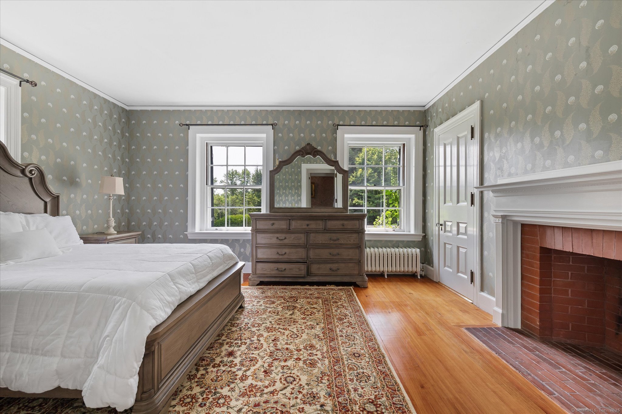 357 Wrights Crossing Road Pomfret, CT 06259 - Photo 30 of 40 a bed room with a bed and a fireplace