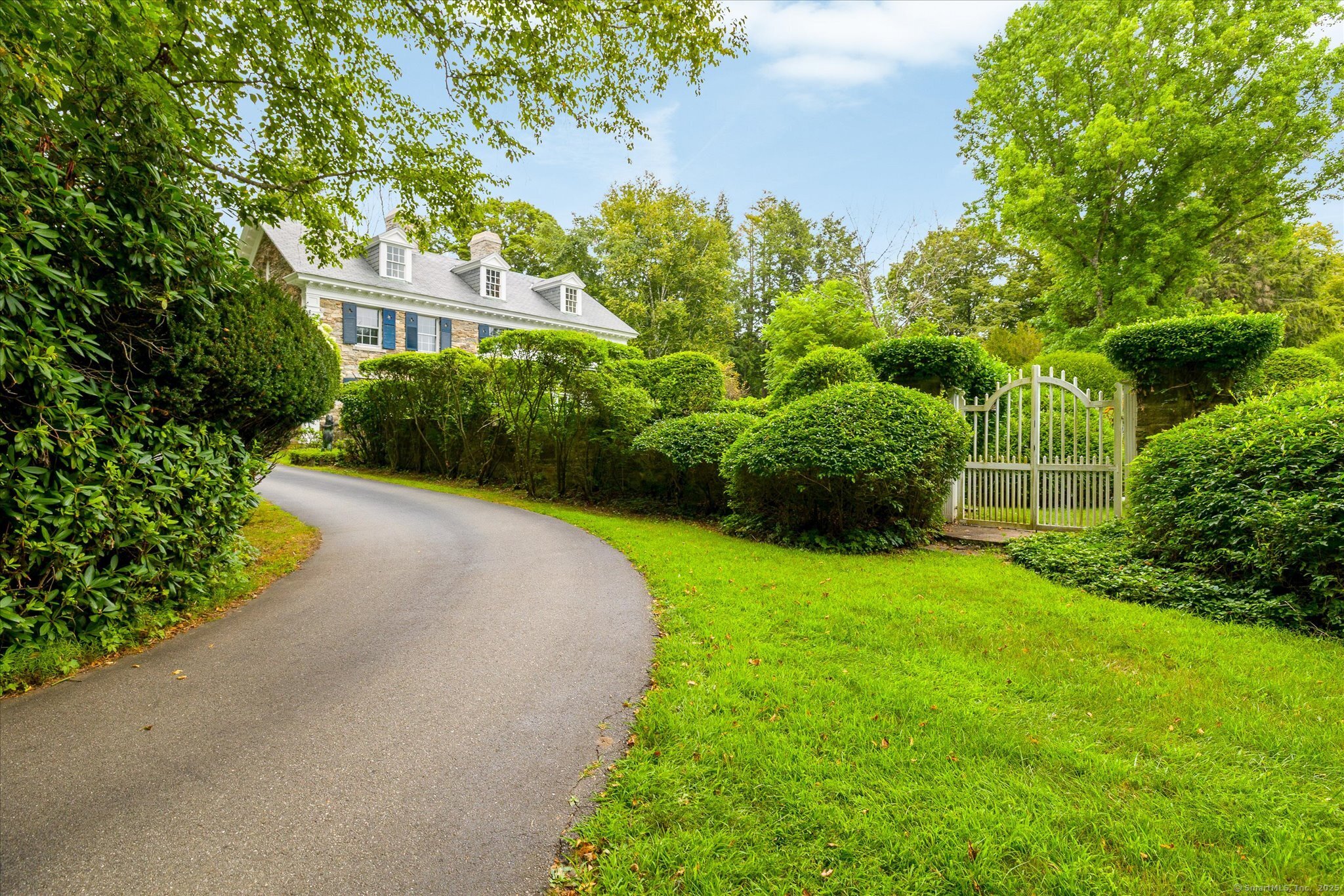 357 Wrights Crossing Road Pomfret, CT 06259 - Photo 3 of 40 a view of a garden with a house in the background