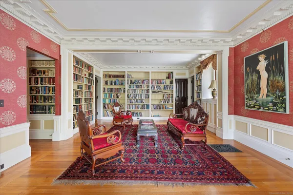 a living room with furniture rug and wooden floor