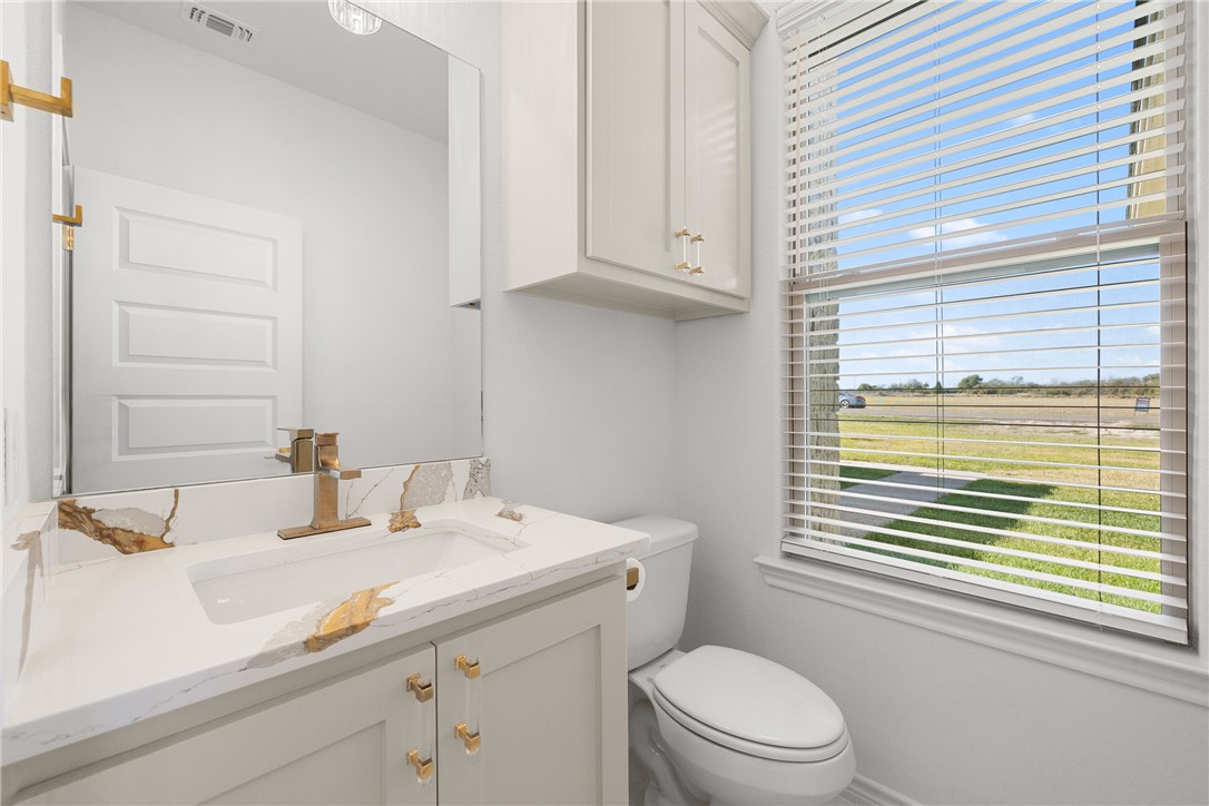 6512 Agave Court Bryan, TX 77808 - Photo 34 of 42 Bathroom featuring vanity and toilet