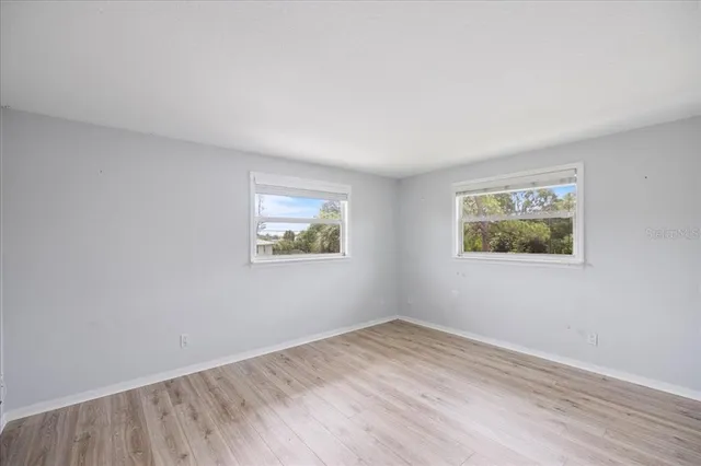 a bathroom with a bathtub shower sink vanity and toilet