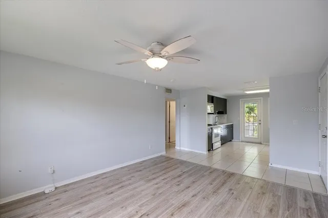 a bathroom with a shower a toilet and a sink