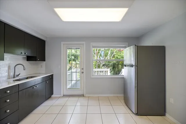 a bathroom with a sink and mirror