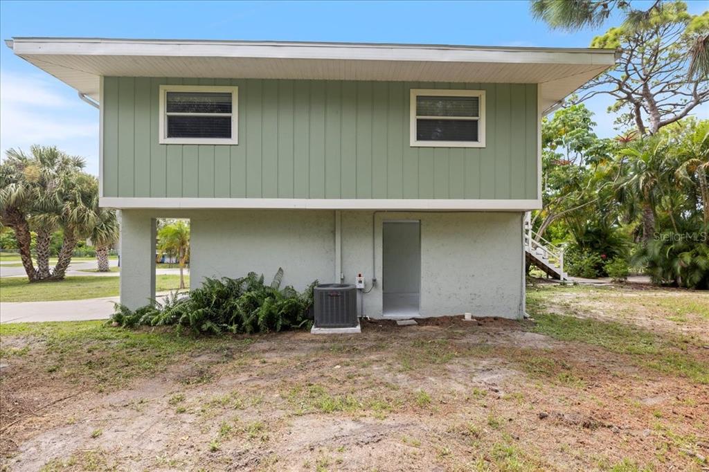 307 Winfield Way Nokomis, FL 34275 - Photo 55 of 58 a front view of a house with garden