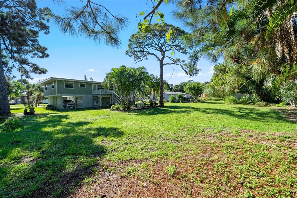 307 Winfield Way Nokomis, FL 34275 - Photo 7 of 58 a view of a house with a big yard