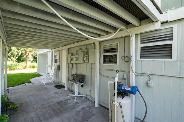 a bedroom with two beds and a chandelier