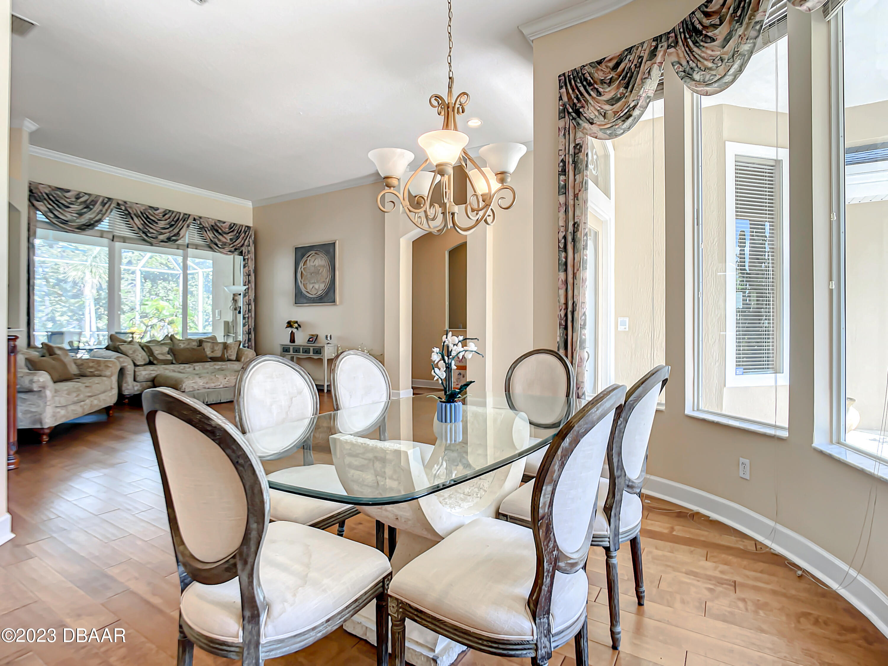 123 Deep Woods Way Ormond Beach, FL 32174 - Photo 11 of 66 a view of a dining room with furniture window and wooden floor