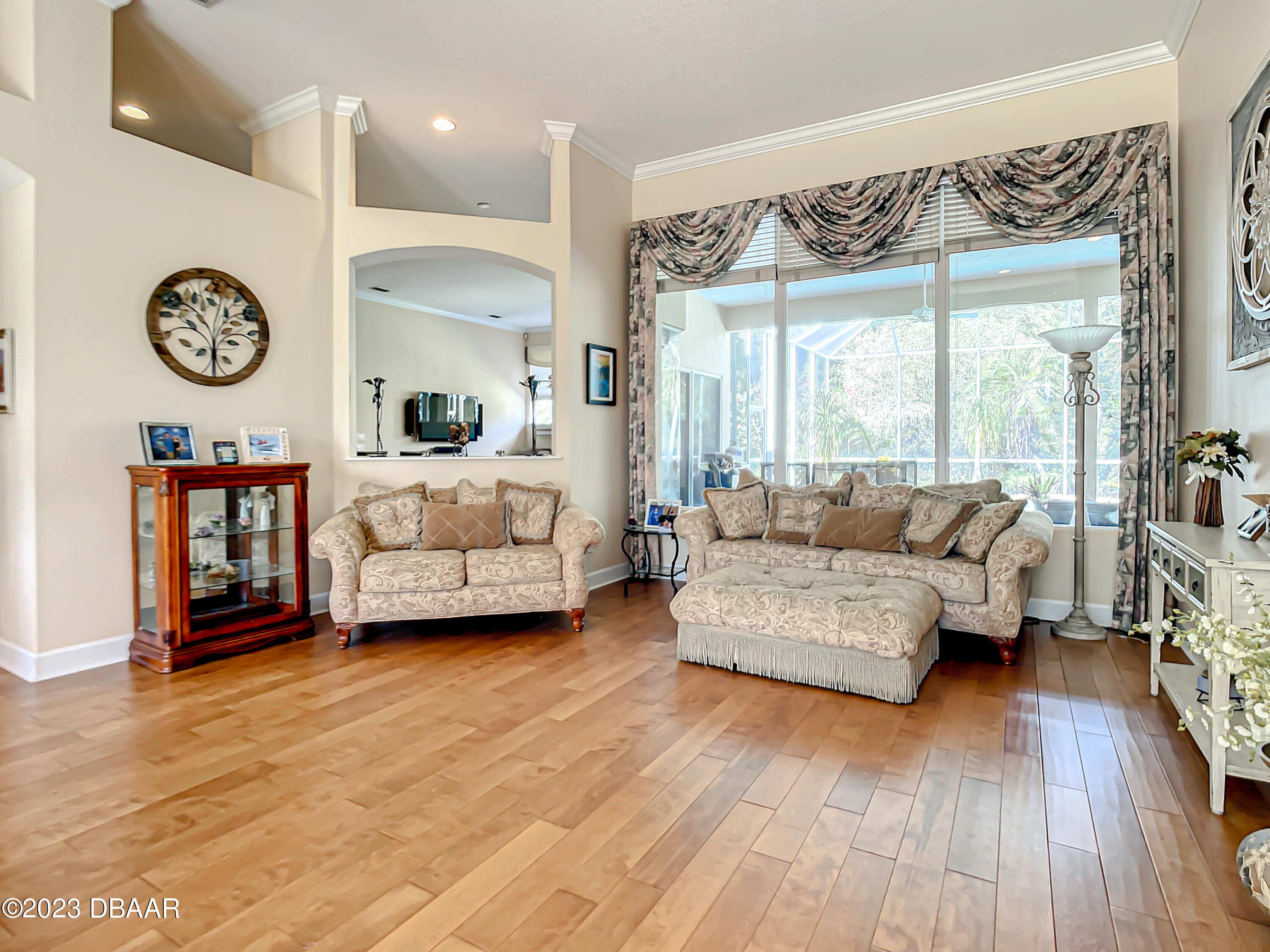 123 Deep Woods Way Ormond Beach, FL 32174 - Photo 12 of 66 a living room with furniture and a large window