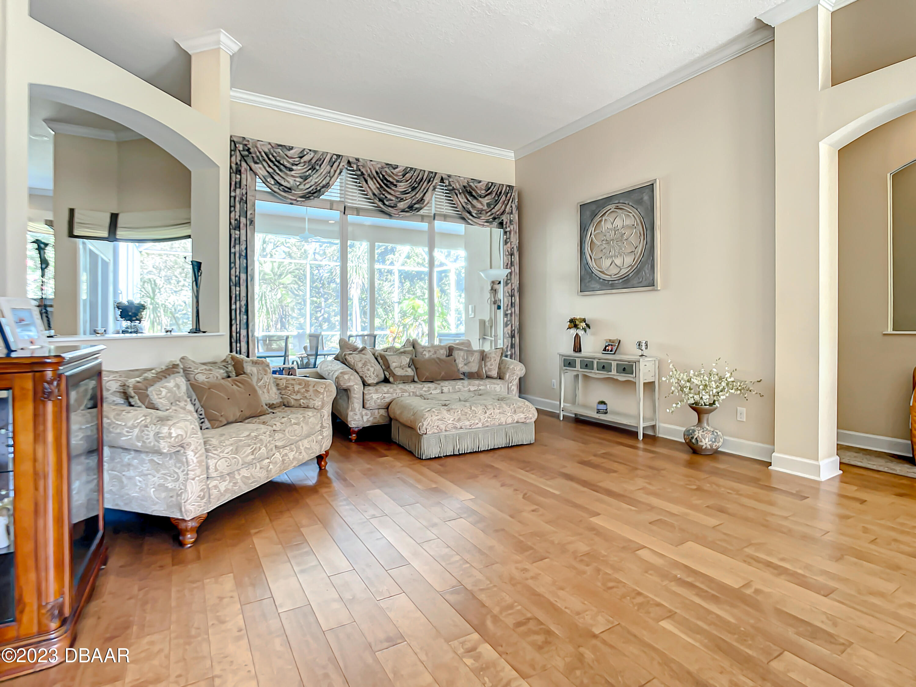 123 Deep Woods Way Ormond Beach, FL 32174 - Photo 13 of 66 a living room with furniture and a large window