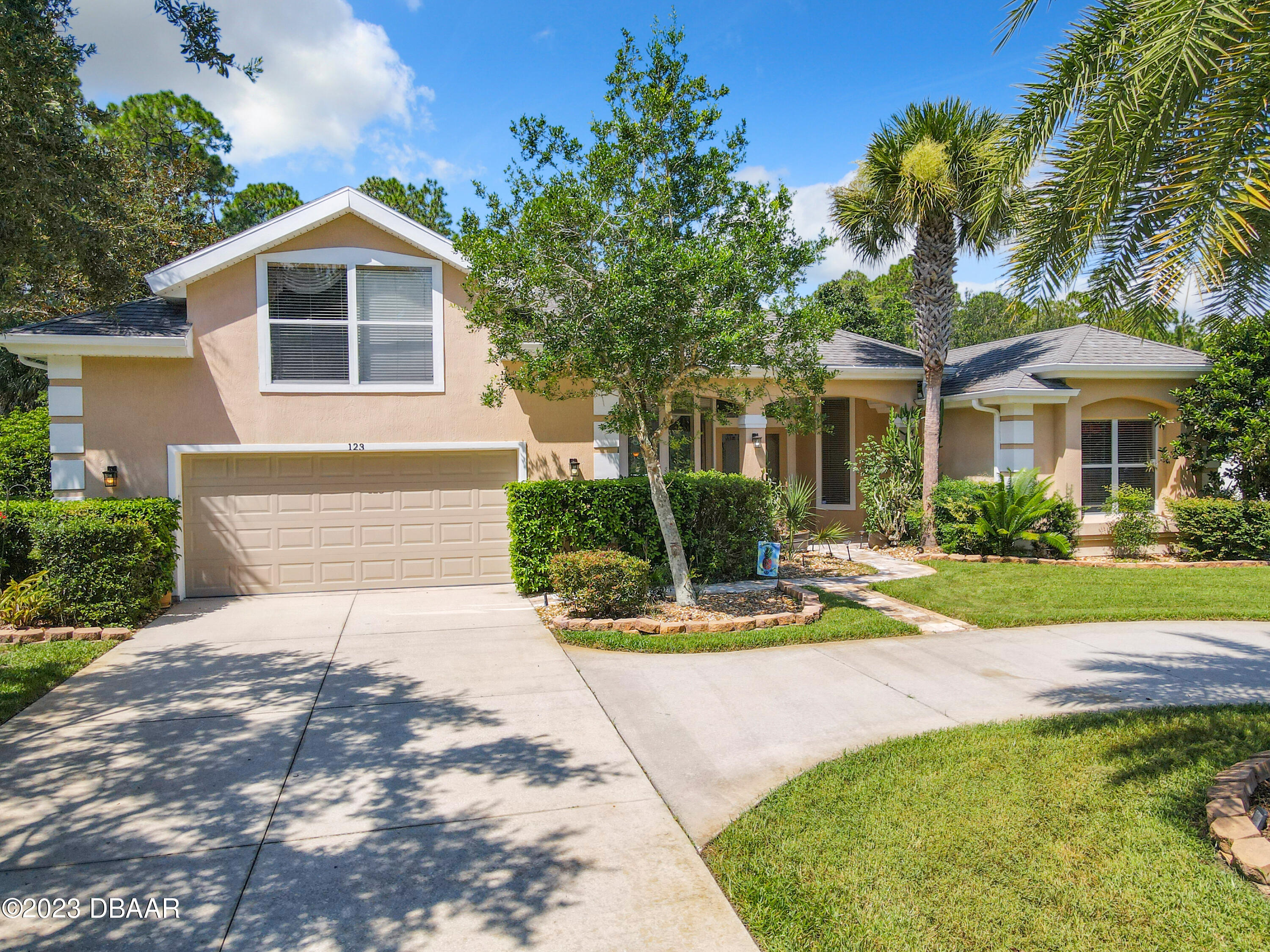 123 Deep Woods Way Ormond Beach, FL 32174 - Photo 2 of 66 a view of a house with backyard and sitting area