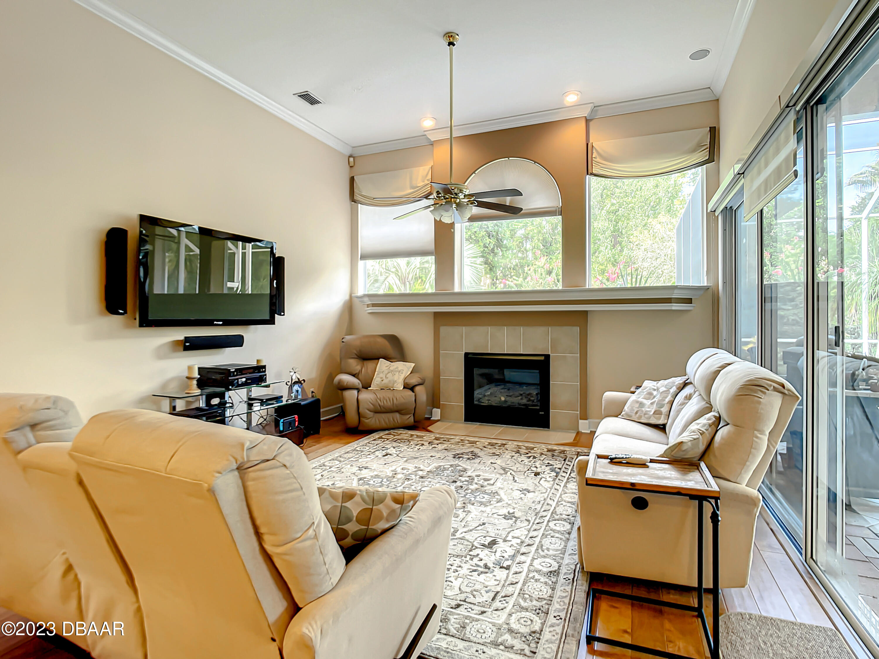 123 Deep Woods Way Ormond Beach, FL 32174 - Photo 23 of 66 a living room with furniture fireplace and flat screen tv