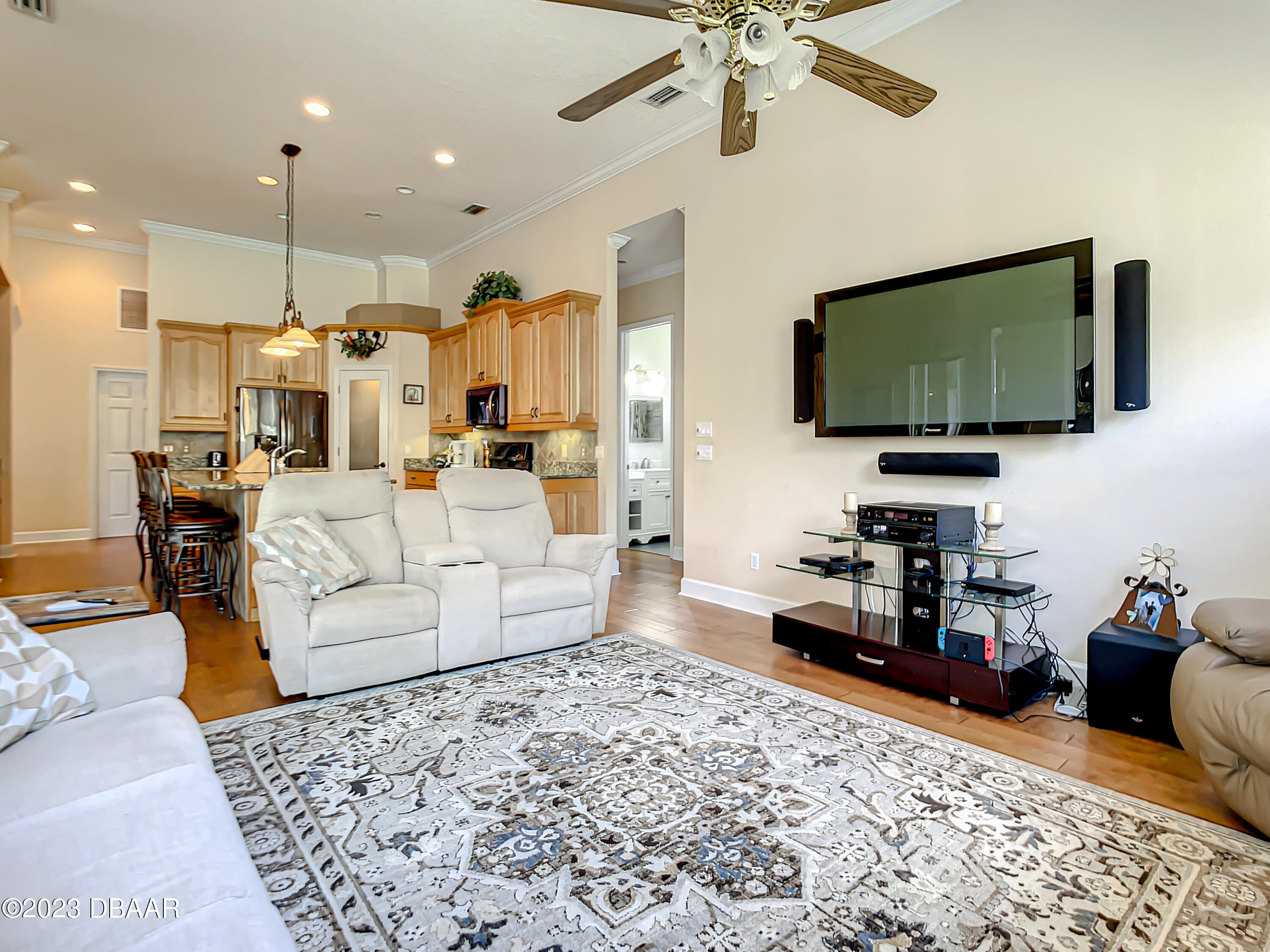 123 Deep Woods Way Ormond Beach, FL 32174 - Photo 25 of 66 a living room with furniture and a flat screen tv
