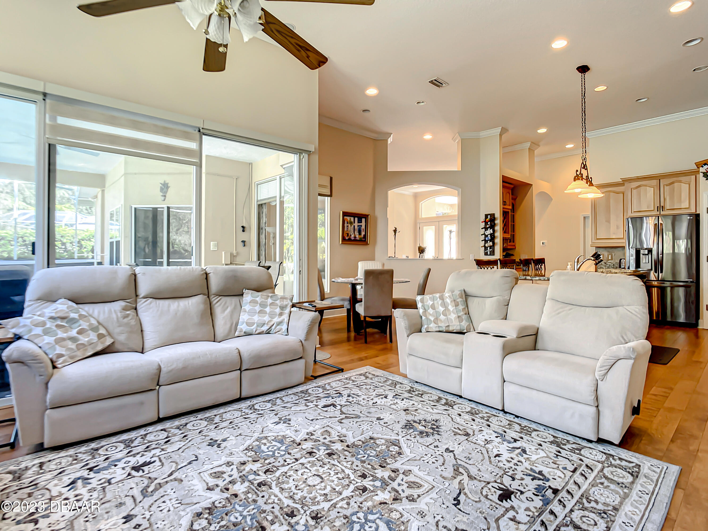 123 Deep Woods Way Ormond Beach, FL 32174 - Photo 26 of 66 a living room with furniture and a large window