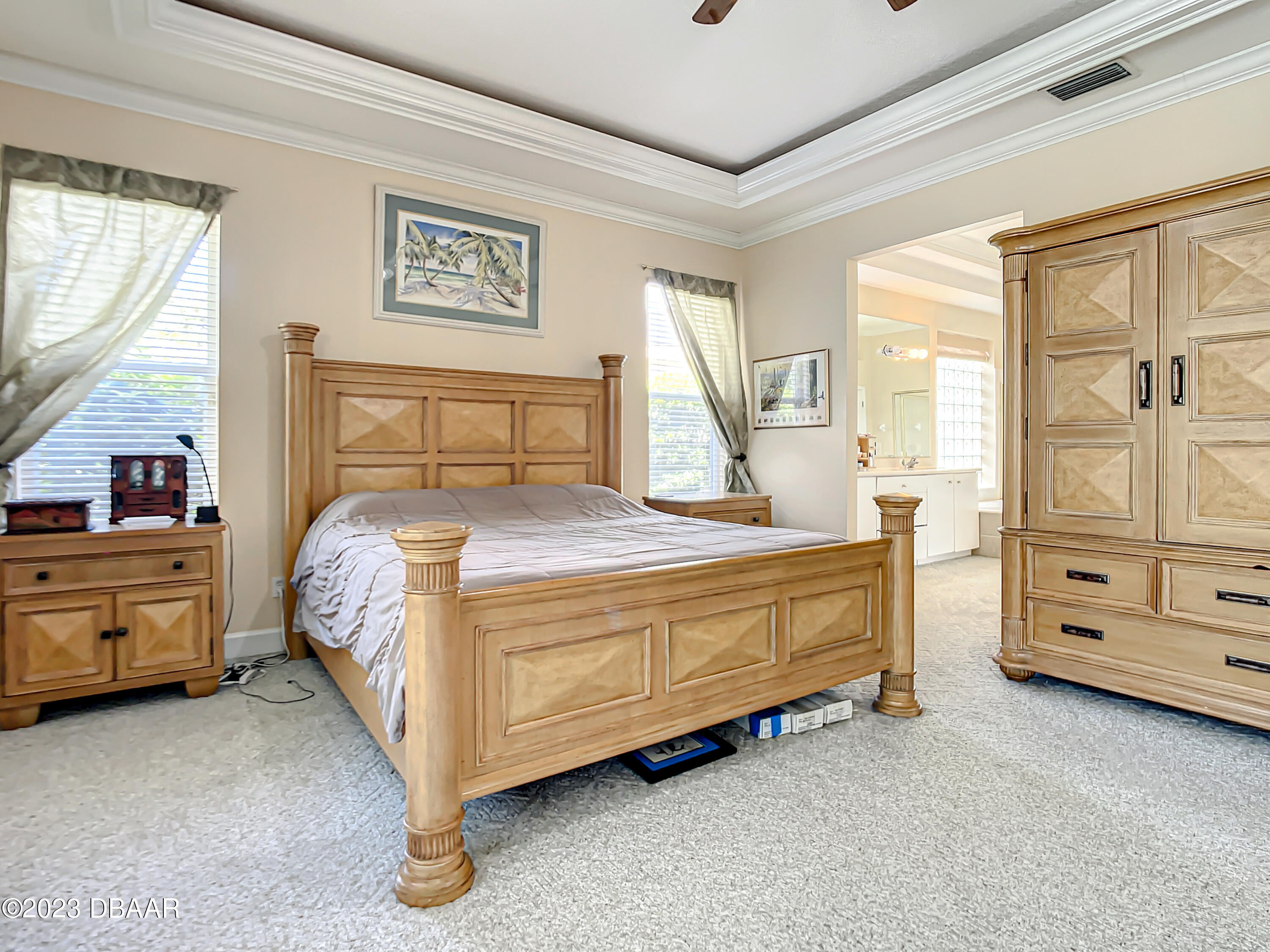 123 Deep Woods Way Ormond Beach, FL 32174 - Photo 27 of 66 a large bed sitting in a room next to a window