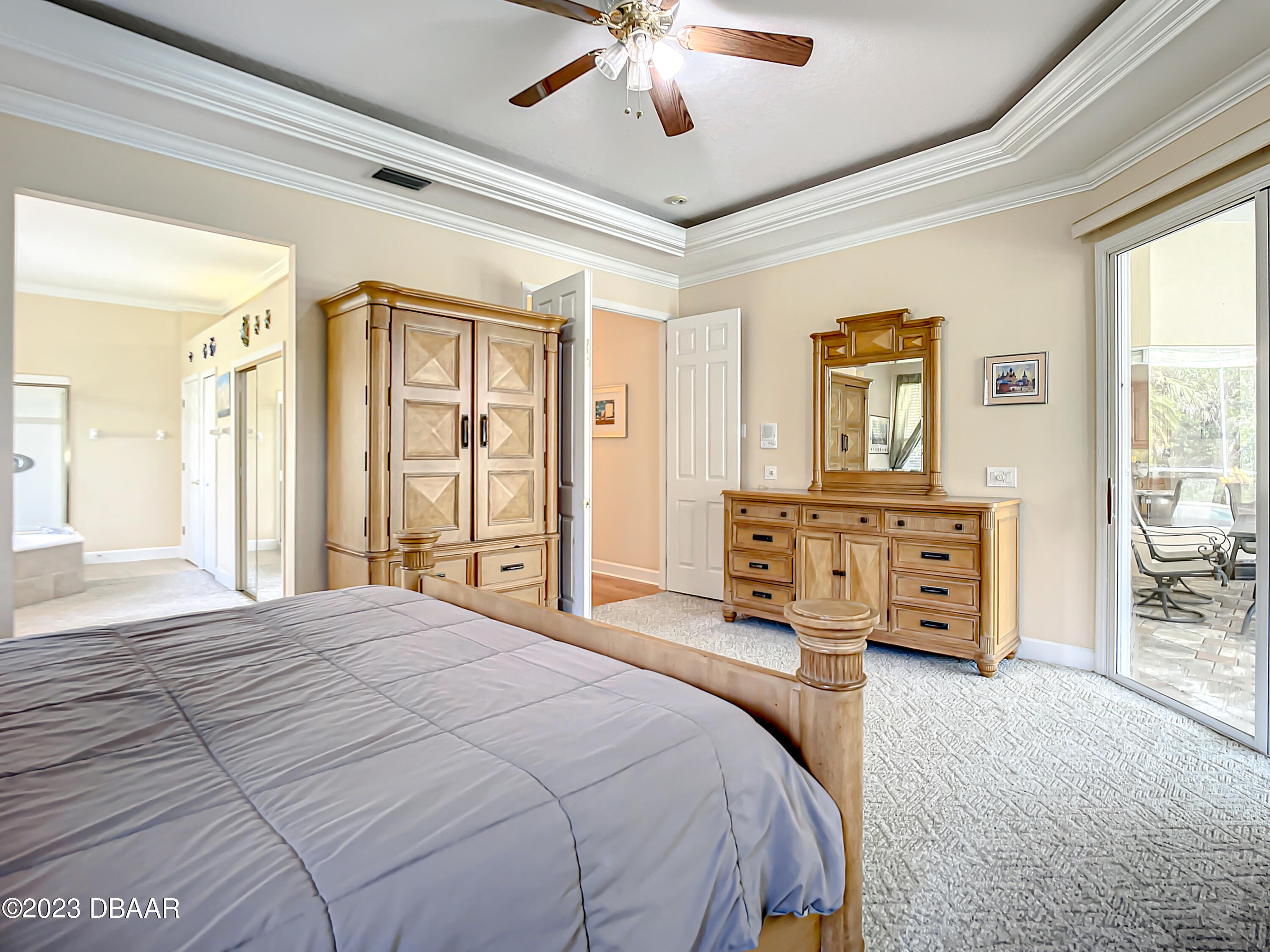 123 Deep Woods Way Ormond Beach, FL 32174 - Photo 29 of 66 a bedroom with a large bed and a tv