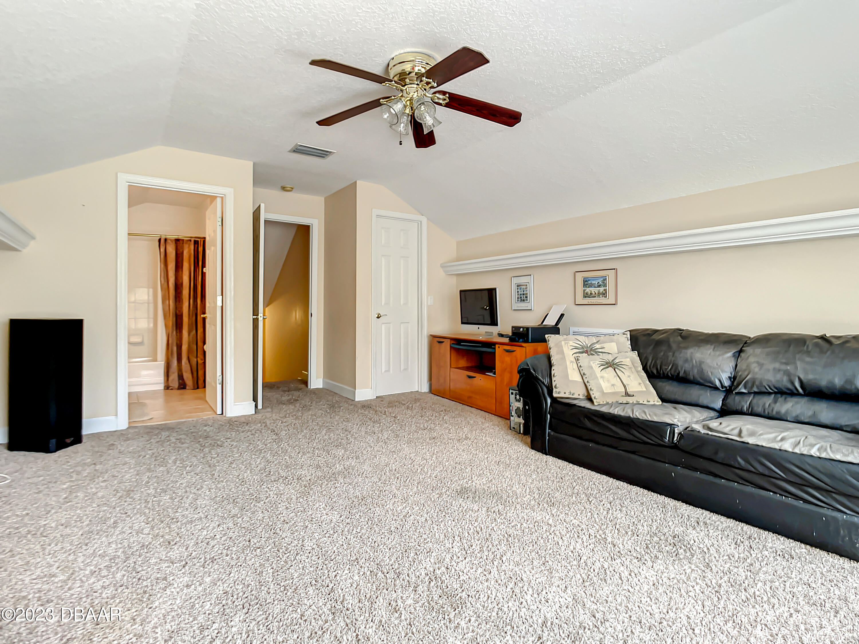123 Deep Woods Way Ormond Beach, FL 32174 - Photo 43 of 66 a bed room with furniture and a ceiling fan
