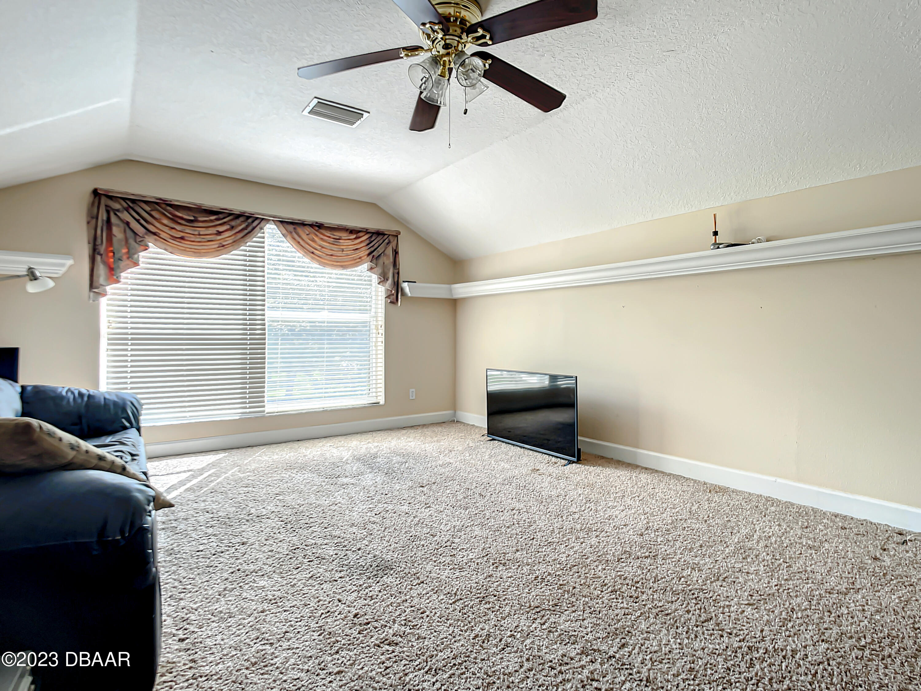 123 Deep Woods Way Ormond Beach, FL 32174 - Photo 45 of 66 a living room with furniture and a window