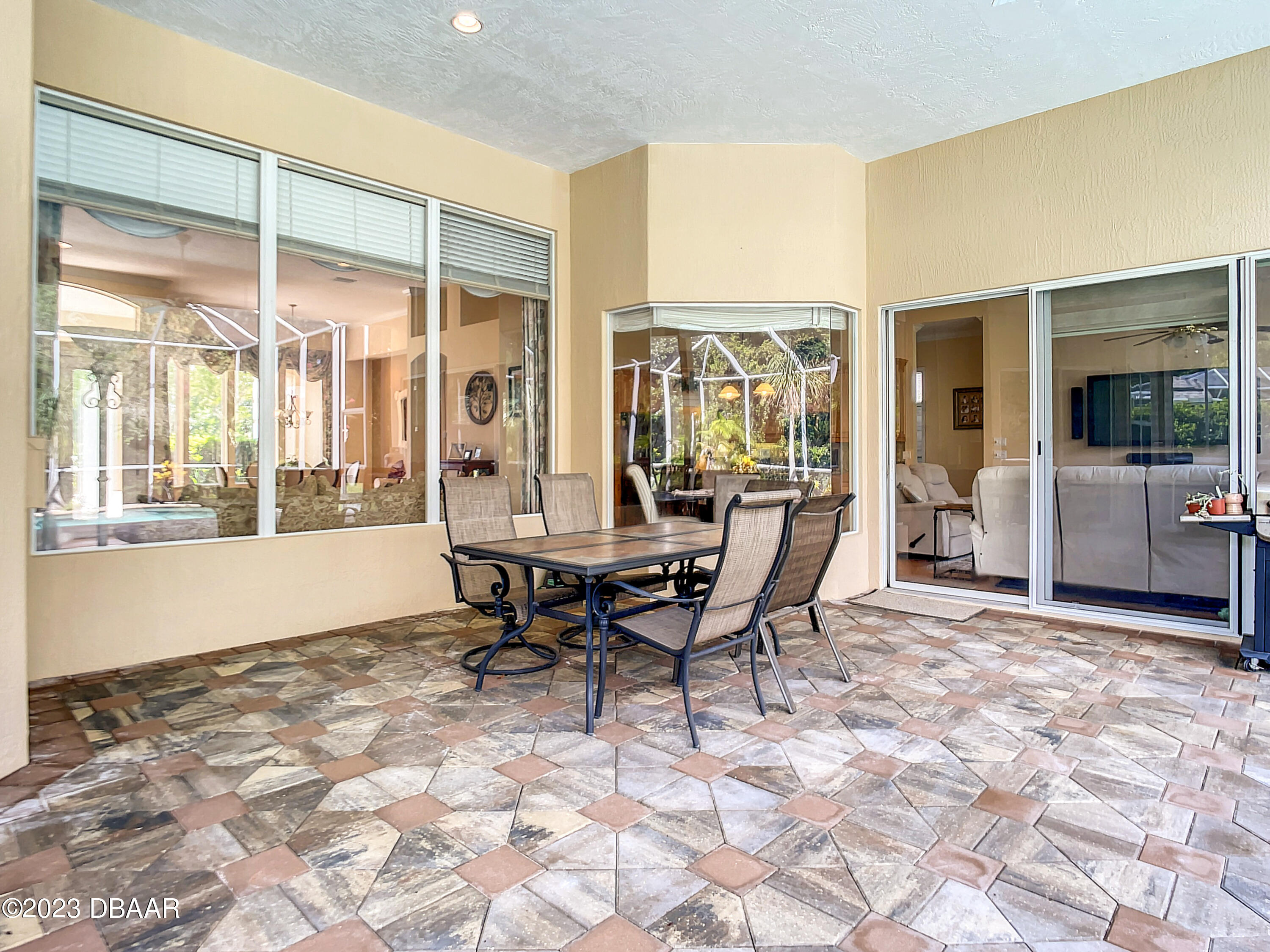 123 Deep Woods Way Ormond Beach, FL 32174 - Photo 49 of 66 a view of a dining room with furniture window and outside view