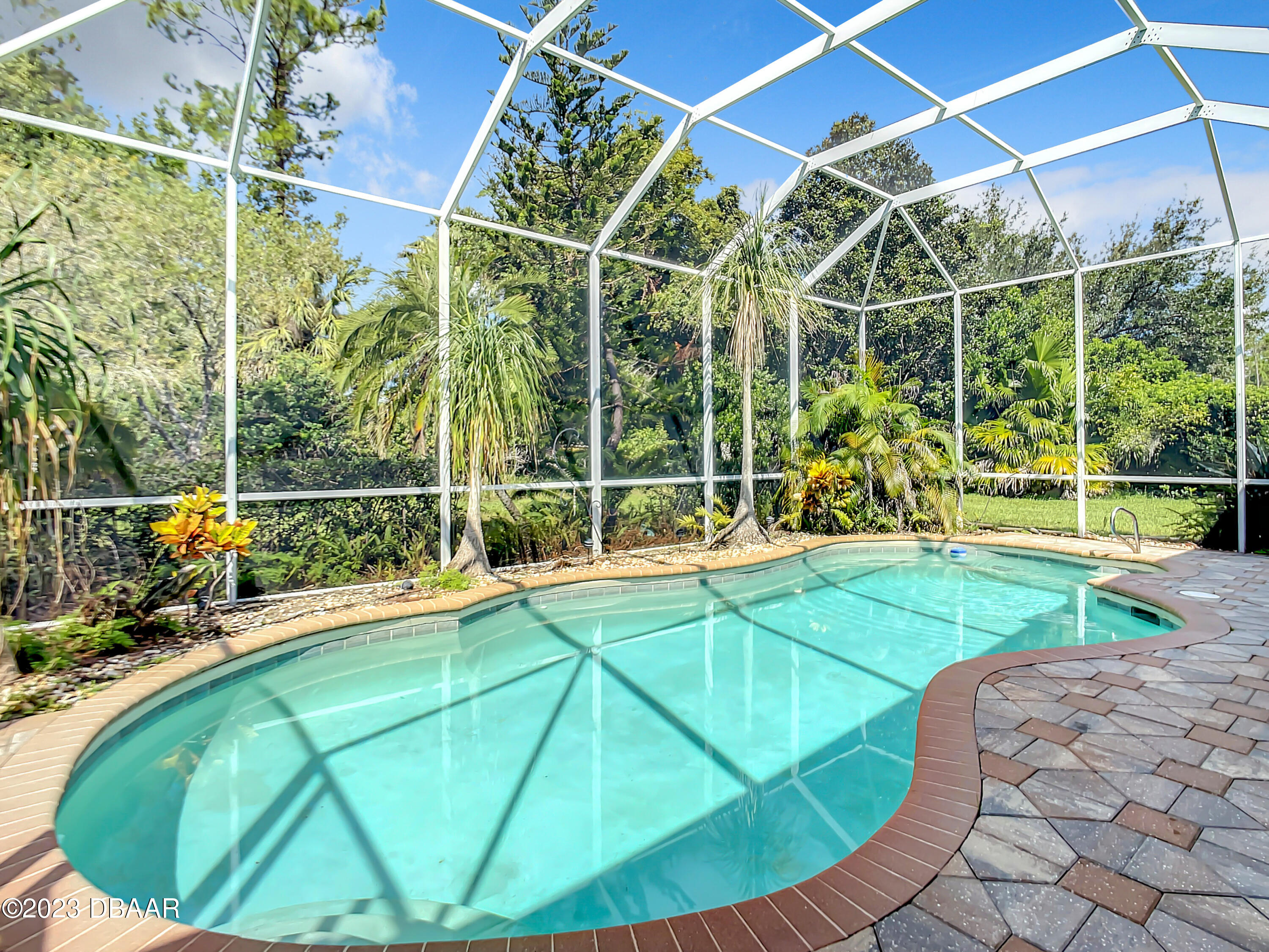 123 Deep Woods Way Ormond Beach, FL 32174 - Photo 51 of 66 a view of a backyard with swimming pool and sitting area