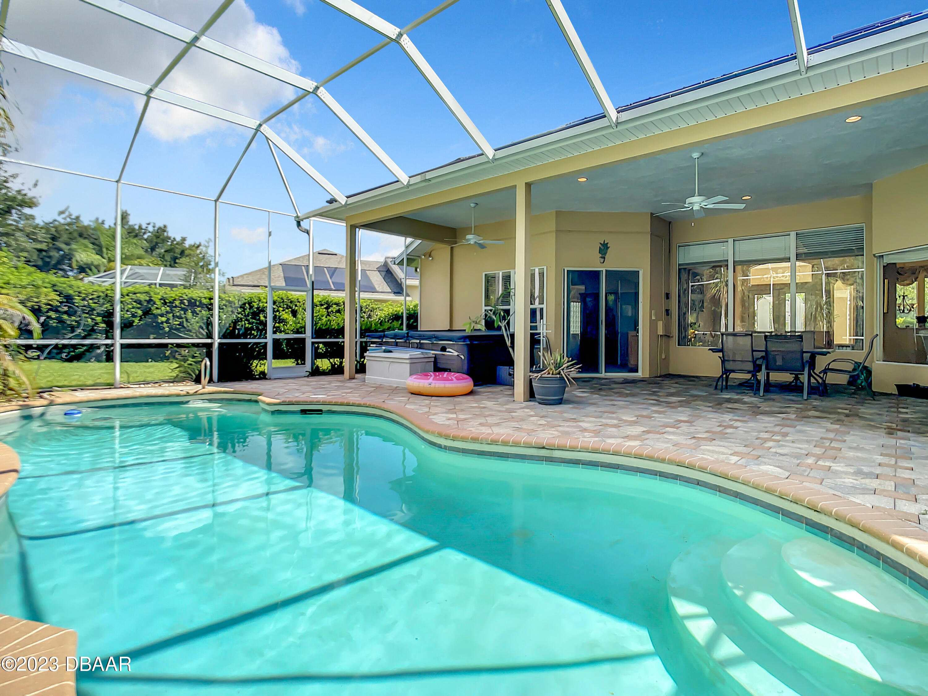 123 Deep Woods Way Ormond Beach, FL 32174 - Photo 52 of 66 a view of a swimming pool with a patio