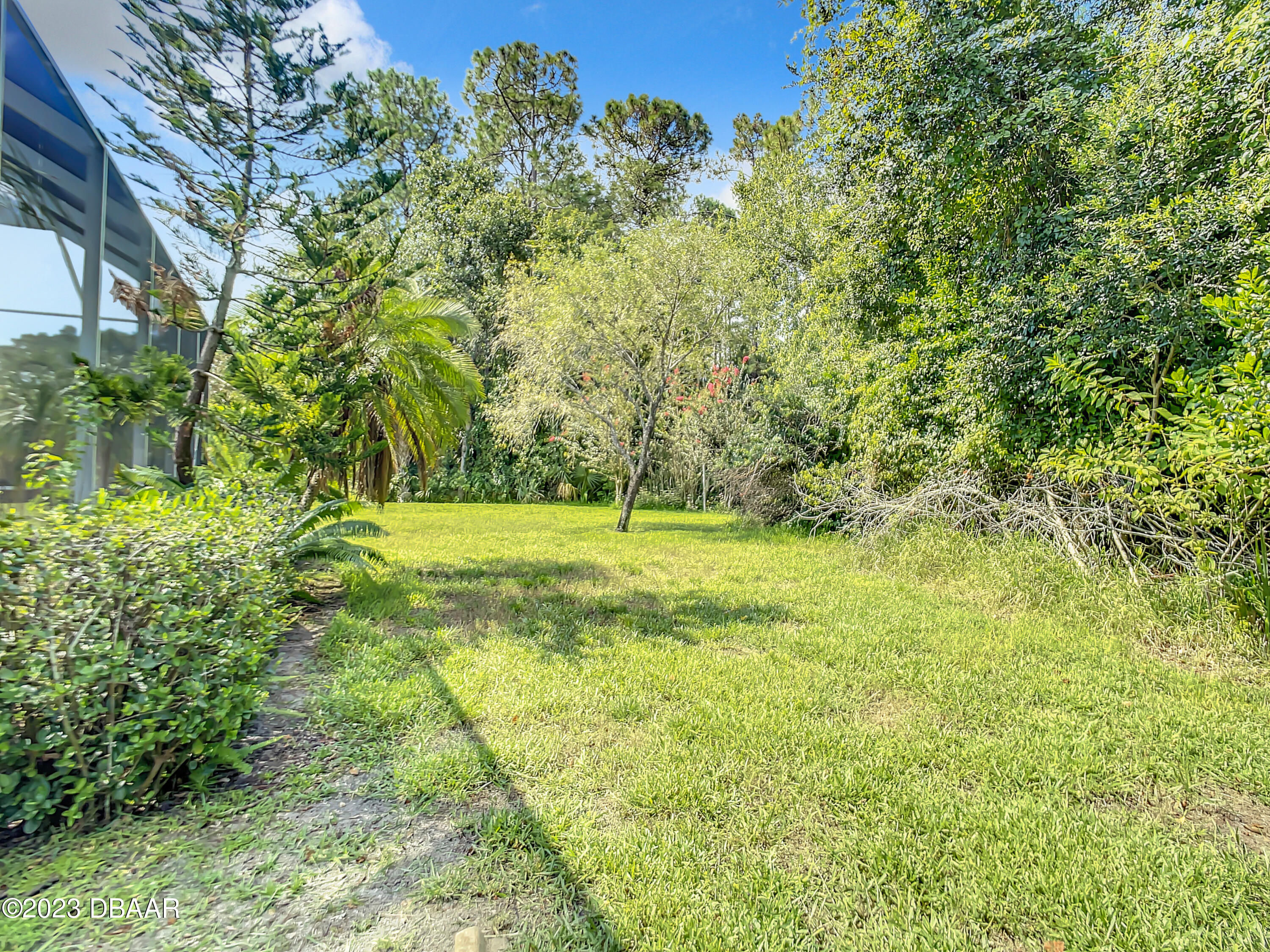 123 Deep Woods Way Ormond Beach, FL 32174 - Photo 55 of 66 a view of outdoor space with deck and yard
