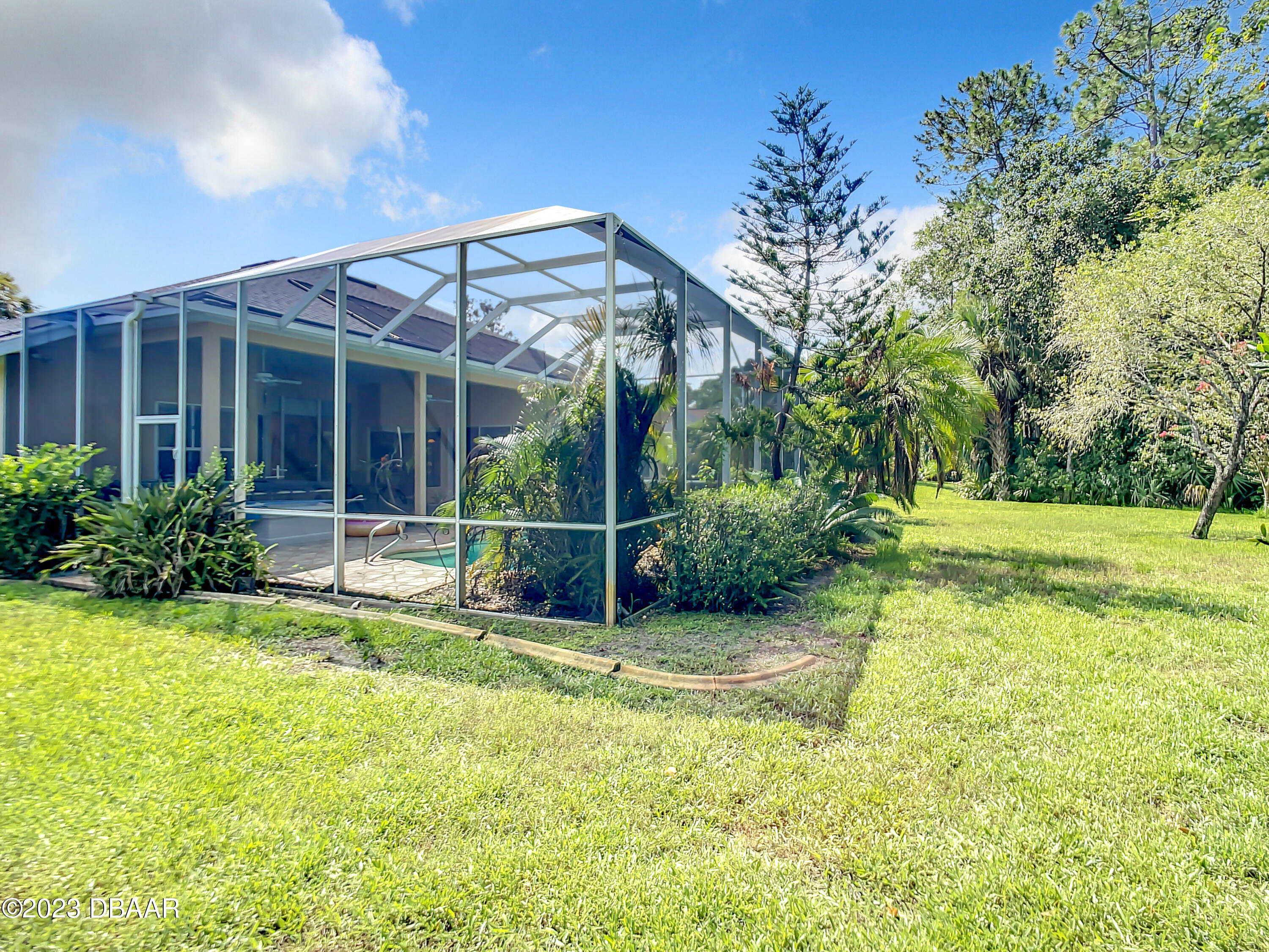 123 Deep Woods Way Ormond Beach, FL 32174 - Photo 56 of 66 a view of a house with backyard and sitting area