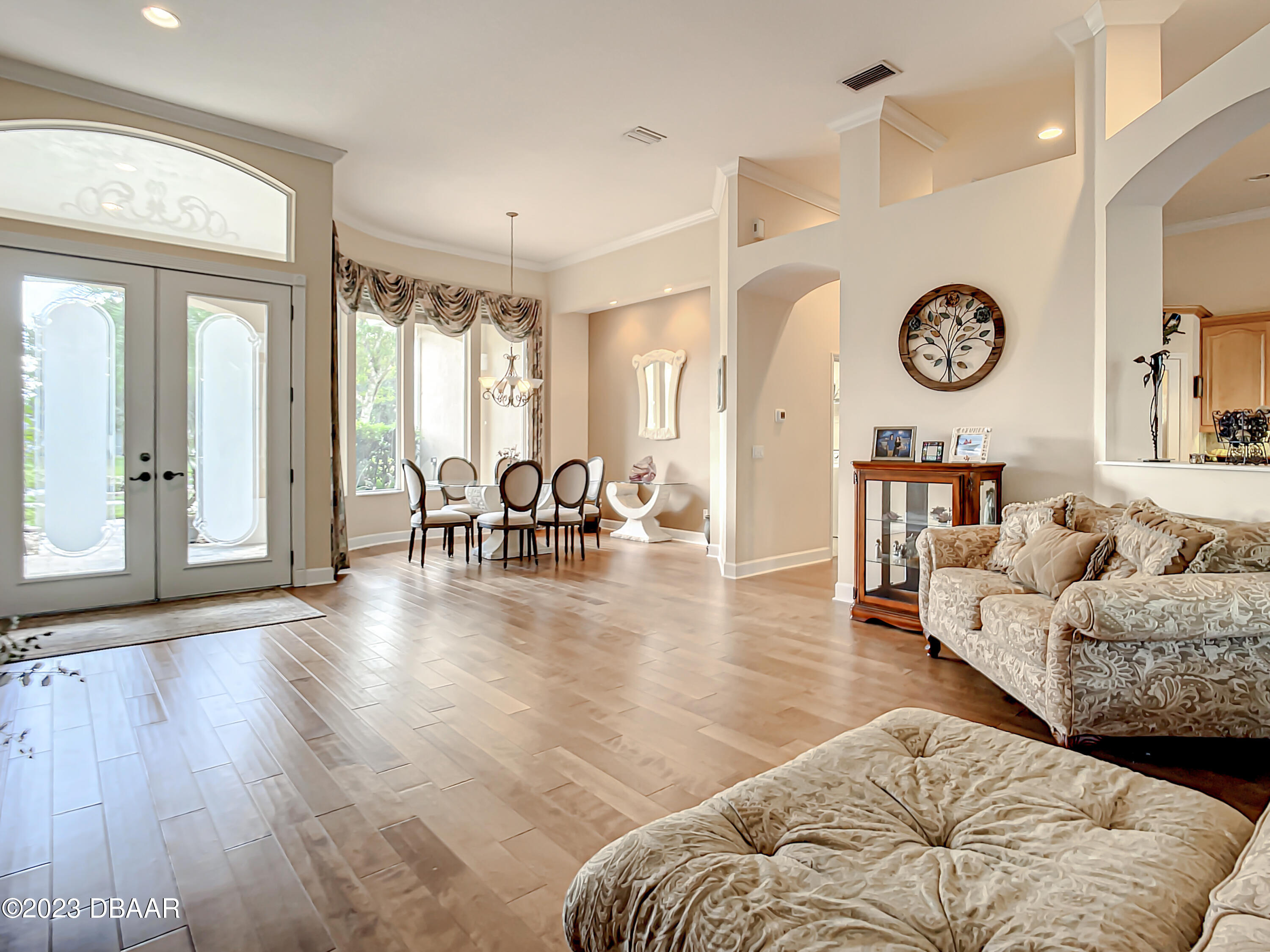 123 Deep Woods Way Ormond Beach, FL 32174 - Photo 7 of 66 a living room with furniture and a wooden floor
