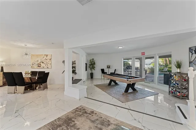 a living room with furniture and view of living room